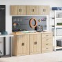 Sechsteiliges Garagenschrank-Set in Sonoma-Eiche mit Hänge- und Unterschränken, Schubladen und Arbeitsplatte.