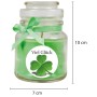 Grüne Duftkerze "Viel Glück" im Glas mit Kokosduft, verziert mit Schleife.