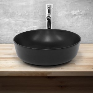 ML-Design Handwaschbecken, Keramik, Schwarz Matt, rund, mit Armatur auf Holzplatte.