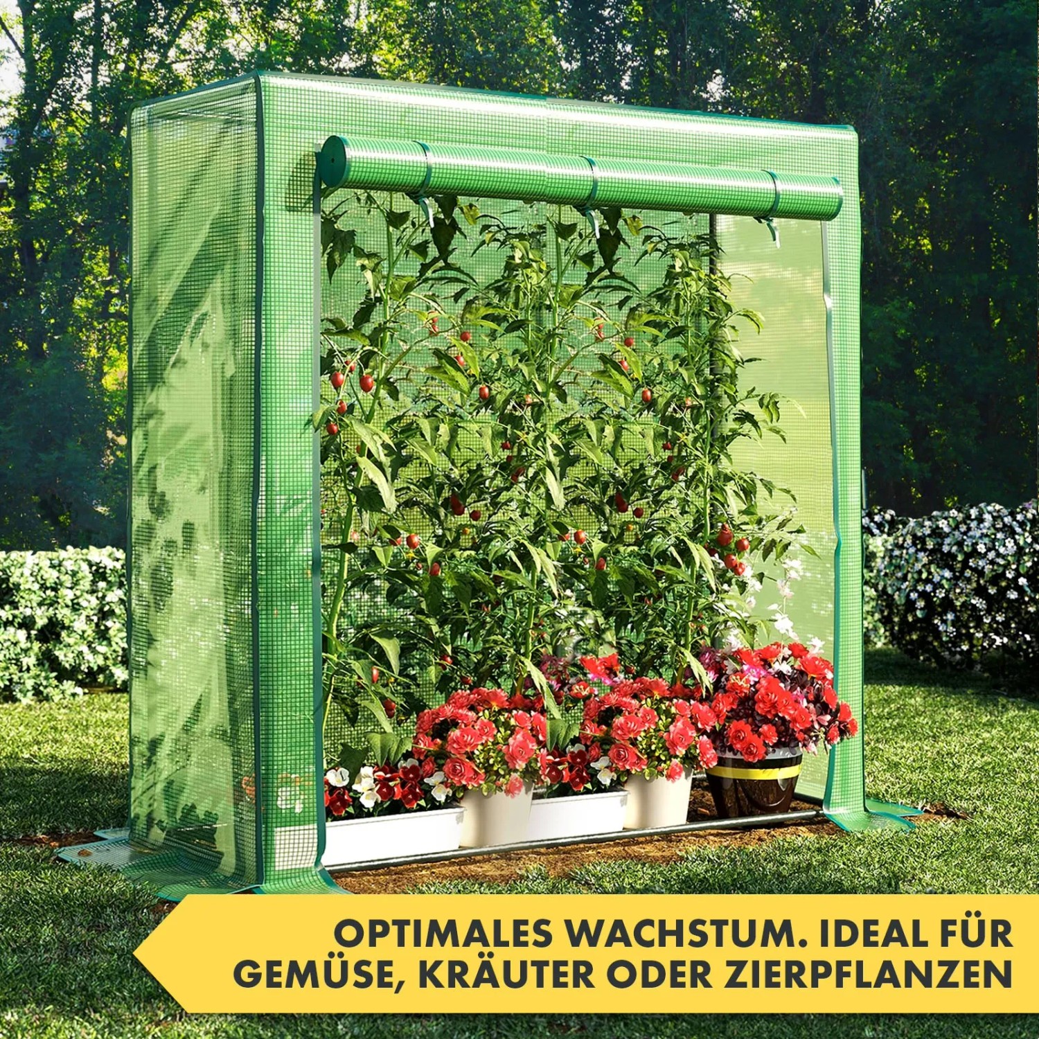 Grünes KARAT Gewächshaus Botanika mit Pflanzen und Gemüse im Garten.