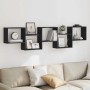 Schwarzes vidaXL Würfelregal mit 5 Fächern aus Holzwerkstoff an einer Wand über einem Sofa.