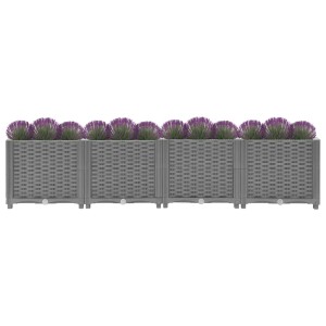 Hellgraues vidaXL Hochbeet (160x40x38 cm) mit Rattan-Optik und lila Zierlauch.