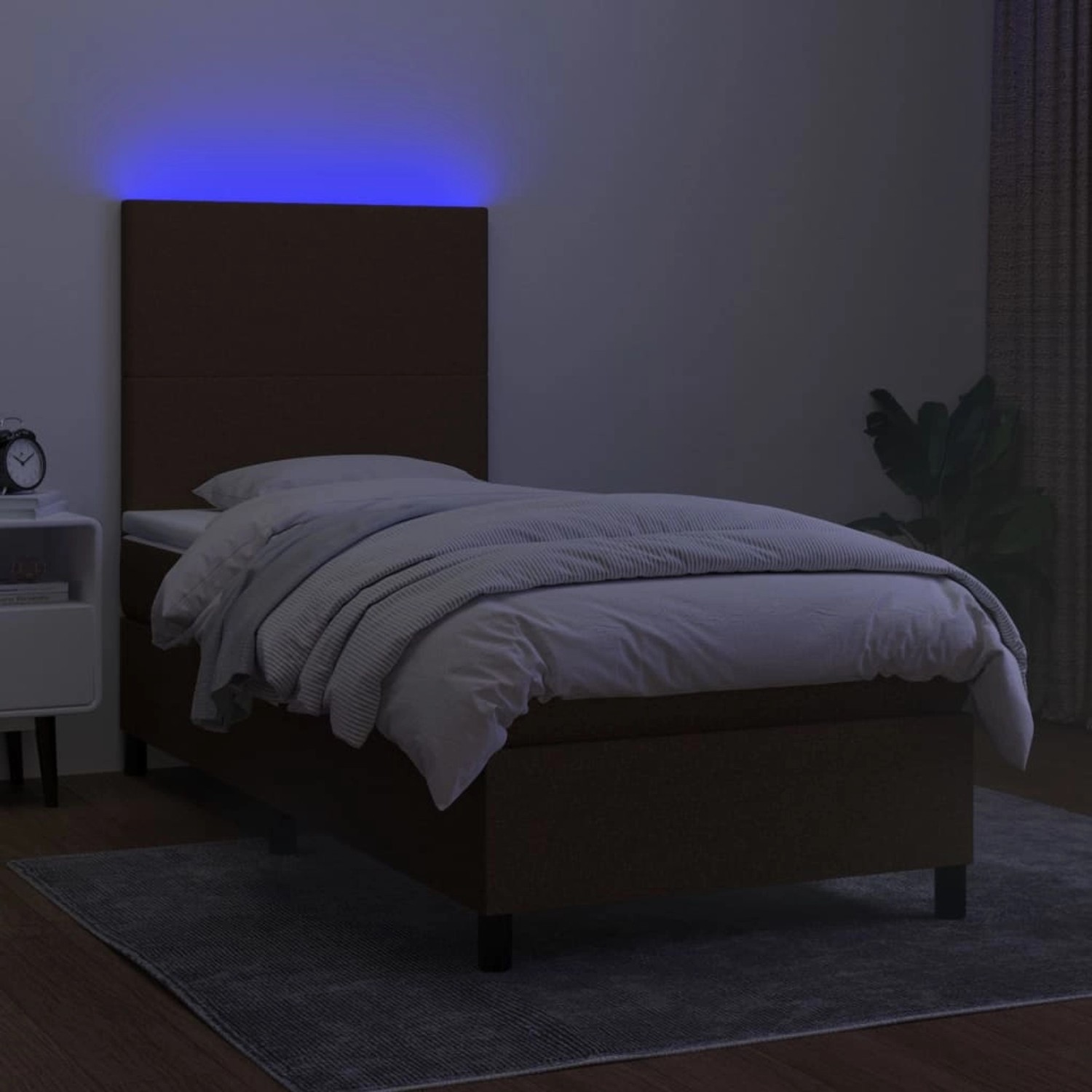 Dunkelbraunes Boxspringbett mit LED-Beleuchtung und Matratze, Stoffbezug, 90x190 cm.