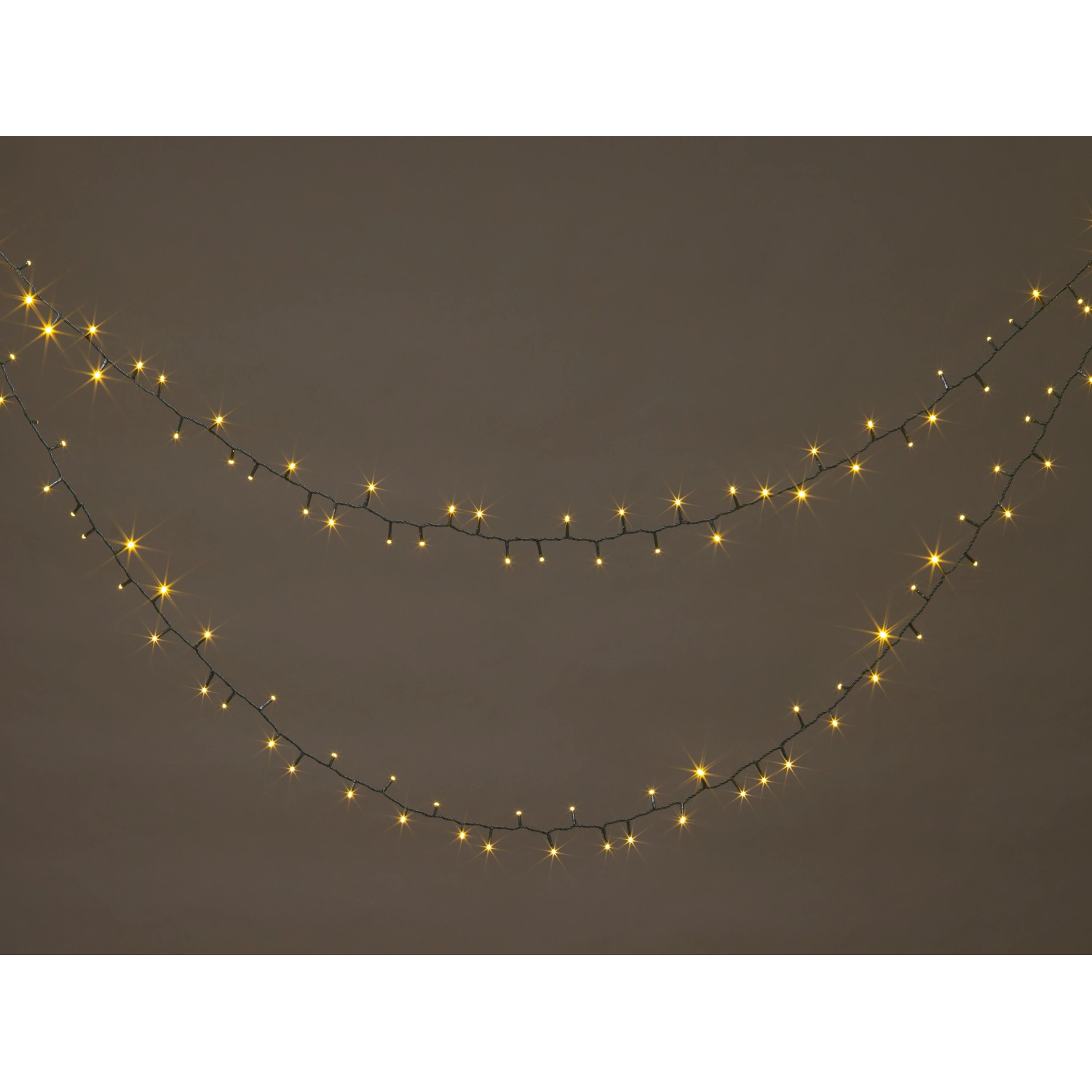 Warmweiße LED-Lichterkette, 24 m, für Innen und Außen, mit grüner Zuleitung.