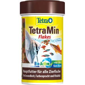 Tetra Min Flakes 100ml, Flockenfutter für Zierfische im gelben Behälter.