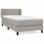 Helles Boxspringbett 100x200 cm mit Matratze und Kopfteil, Stoffbezug.