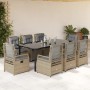 9-teilige Garten Essgruppe aus Poly Rattan mit schwarzen Tisch und beigen Stühlen mit grauen Kissen.