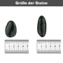 Zierkies schwarz poliert: Zwei Kieselsteine mit Größenangabe (2-3 cm) auf einem Lineal.