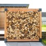Westmann Kaminholzregal Michel XXL aus Lärchenholz, gefüllt mit Kaminholz. FSC®-zertifiziert.