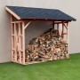 Holzunterstand Paul 2 aus Douglasie, naturbelassen, mit Dach und Kaminholz gefüllt.
