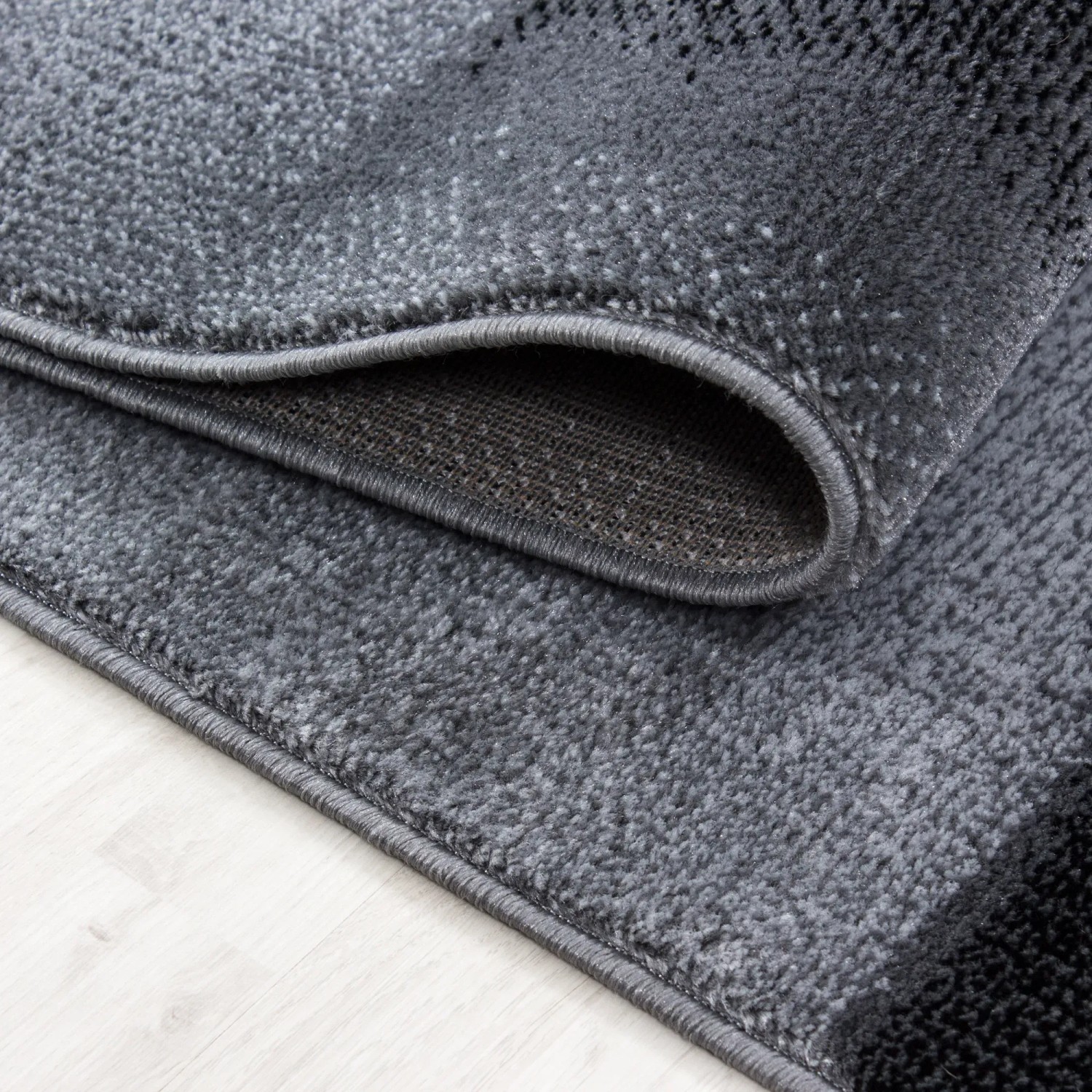 Detailansicht: Ayyildiz Kurzflorteppich Parma 9250 in Schwarz/Grau, 80x300 cm.