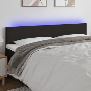 Schwarzes vidaXL LED Kopfteil 200x5x78/88 cm aus Stoff am Bett montiert.