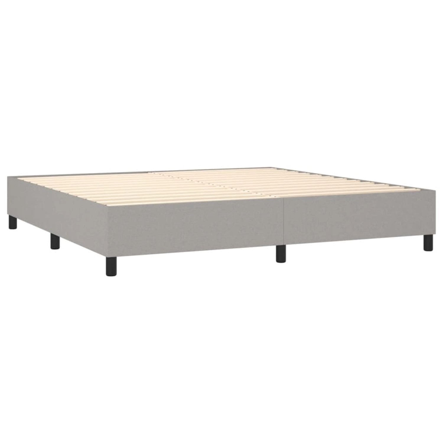 Helles, stoffbezogenes Boxspringbett 200x200 cm ohne Matratze und Kopfteil.