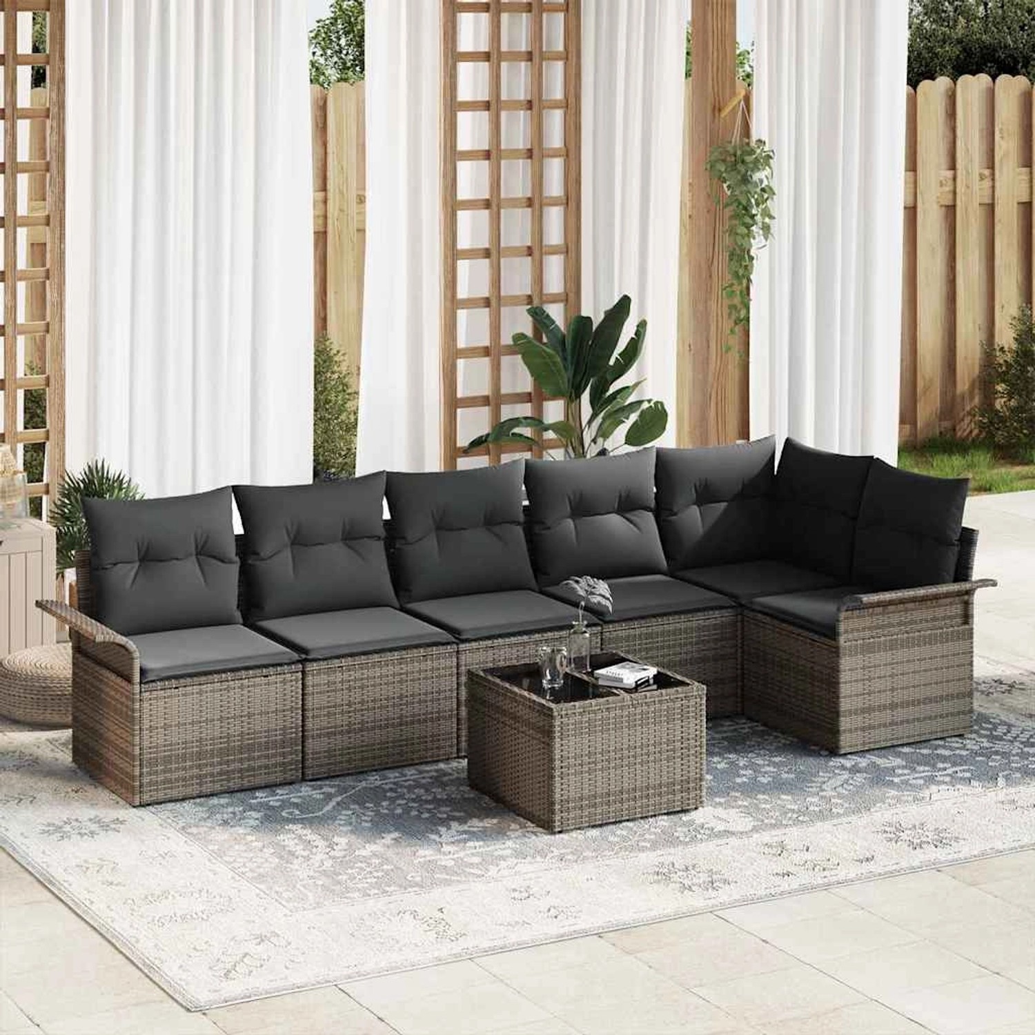 Graues 7-teiliges vidaXL Garten-Sofa-Set aus Poly Rattan mit Tisch und Kissen.