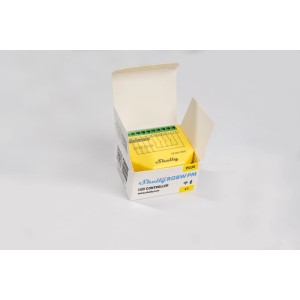 Gelber Shelly Controller RGBW Plus PM in geöffneter Verpackung für Hausautomation.