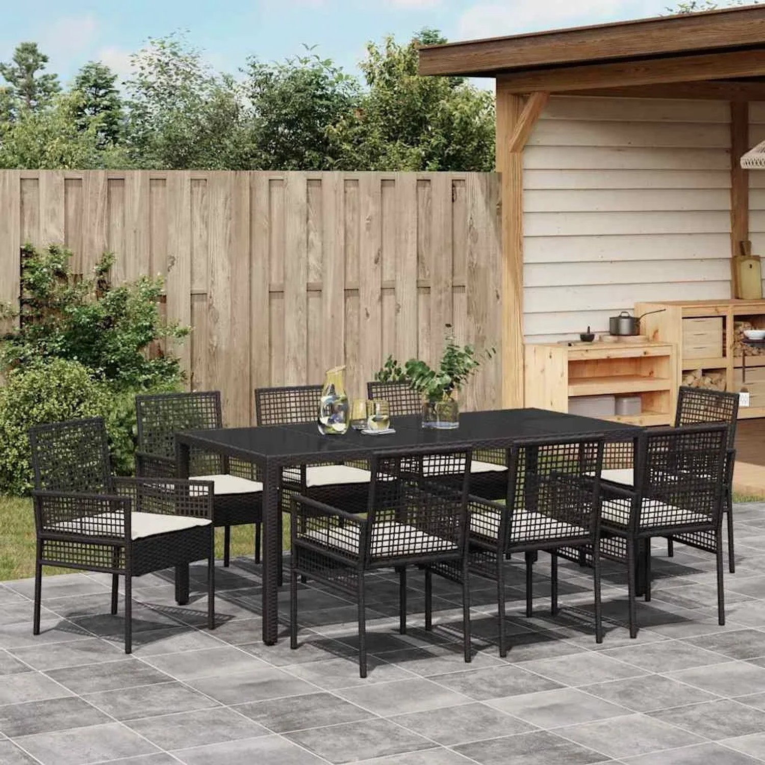 Schwarze 9-tlg. vidaXL Garten Essgruppe aus Poly Rattan mit Tisch und 8 Stühlen.