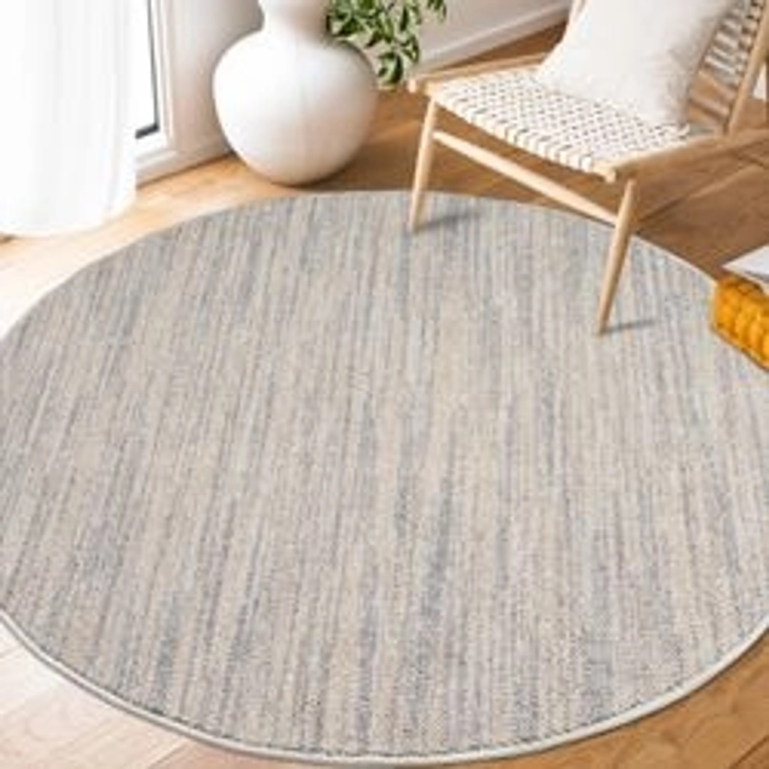 Runder, grauer payé Teppich Klassiko 52 mit Fransen, 160x160 cm. Kurzflor Teppich im Boho-Look.