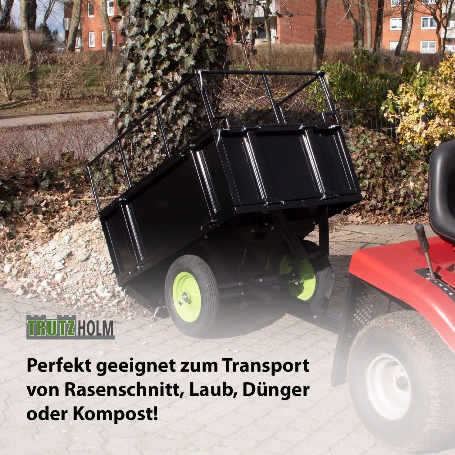 Schwarzer TRUTZHOLM Rasentraktor Anhänger, kippbar, mit Gitteraufsatz.