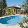 Ovaler Summer Fun Stahlwandpool Florida (700x350x150 cm) im Garten.