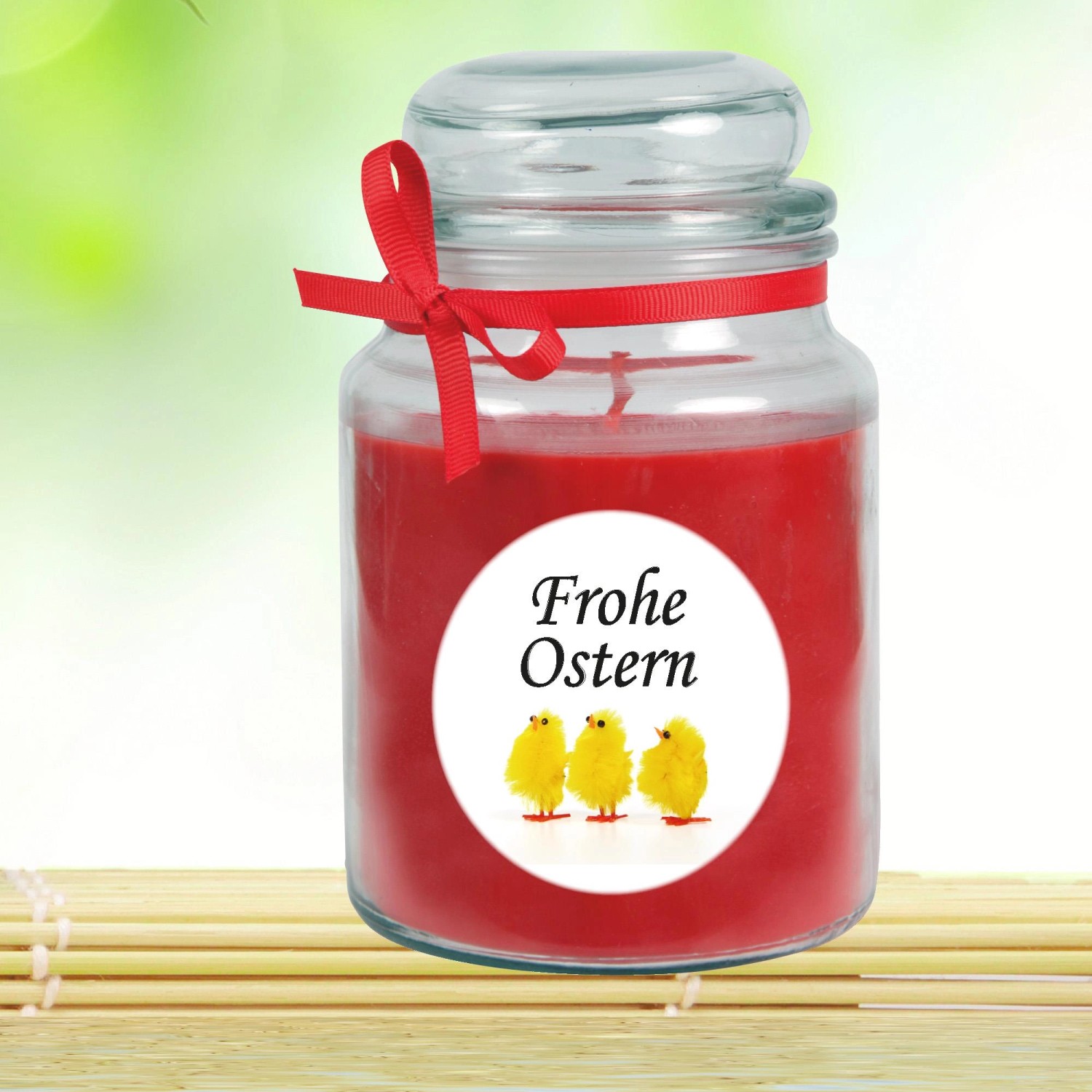 Duftkerze Frohe Ostern im Glas mit Küken-Motiv und roter Schleife, Ø10 cm.