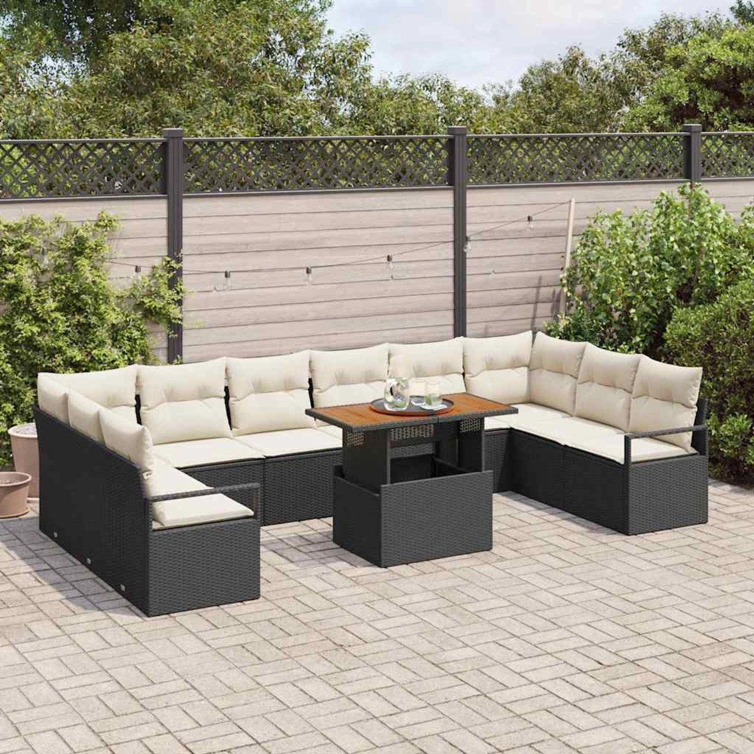 Schwarzes 11-tlg. vidaXL Garten-Sofa-Set mit Stauraum und Tisch aus Polyrattan.