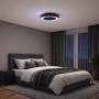 Schwarze LED-Deckenleuchte Catania mit Ventilator und RGB-Beleuchtung im Schlafzimmer.