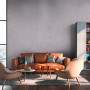 Wohnzimmer mit grauer Beton-Vliestapete "Metropolitan Stories II" von OBI.