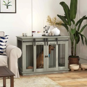Grauer PawHut Hundekäfig aus MDF und Stahl mit Schiebetüren, genutzt als Hundehütte im Wohnzimmer.