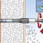 Abstandsmontagesystem Thermax 10/140: Dübel wird in gedämmte Fassade geschraubt.