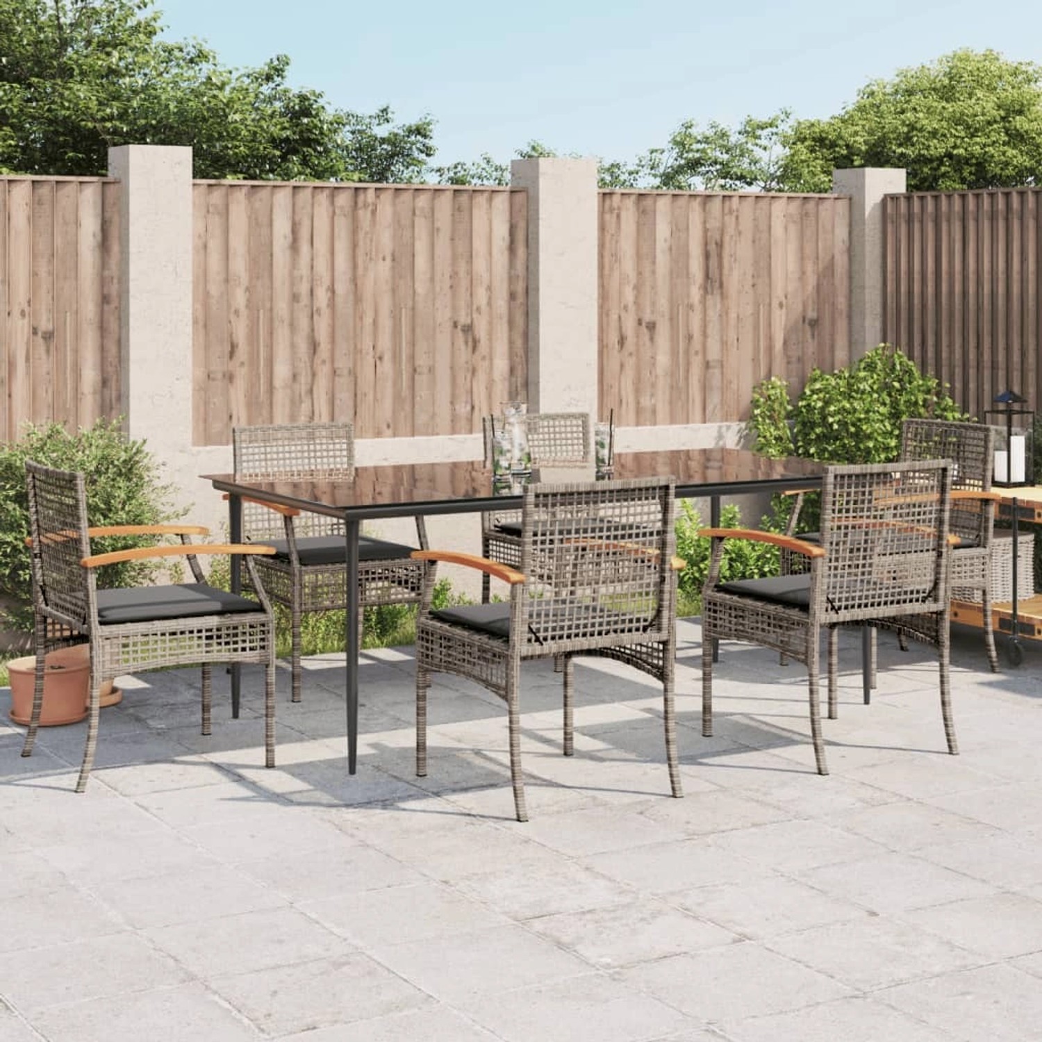 7-tlg. Garten-Essgruppe vidaXL aus grauem Poly Rattan mit Tisch und Stühlen mit Kissen.