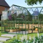 Vitavia Gewächshaus Sirius Smaragd mit Fundament, 13 m², mit Pflanzen und Gemüse im Garten.