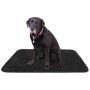 Schwarze Bestlivings Tierdecke Lammflor 80x120 cm mit sitzendem Hund.