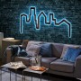 Paulmann FlexLED RGB Set als leuchtende Skyline an dunkler Ziegelwand.
