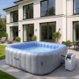 Aufblasbarer, eckiger MCW Whirlpool N97 für 6 Personen in Grau-Blau mit Heizung und Pumpe im Garten.