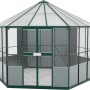 Vitavia Vogelvoliere Circus 9000 Smaragd, ein achteckiges Kunststoff-Gartenhaus mit Zeltdach und grünen Rahmen.