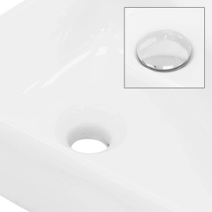Weißes ML-Design Handwaschbecken aus Keramik mit Ablaufgarnitur und Hahnloch rechts.
