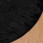 Schwarzer, runder vidaXL Kunstschaffell Teppich (Ø 100 cm) aus Polyester.