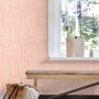 ESTAhome Vliestapete in Rosa mit modernem 3D-Muster aus Linien und Bögen an einer Zimmerwand.