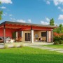 Lasita Maja Ferienhaus Domeo 10, schwedenrot, mit Anbau und Pultdach im Garten.