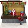 Beleuchtete Weihnachtsdorf Figur aus Polyresin: Geschenkeladen mit Weihnachtsmann, Kind und Schnee.