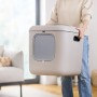 Rotho Katzentoilette Biala XL in Cappuccino wird von einer Person getragen.