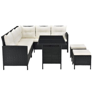 Schwarze Polyrattan Gartenlounge Manacor mit creme Bezügen, bestehend aus Sofa, Tisch und Hockern.