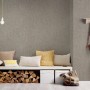 A.S. Création Vliestapete Greenery, taupe metallic, an der Wand im Wohnraum.