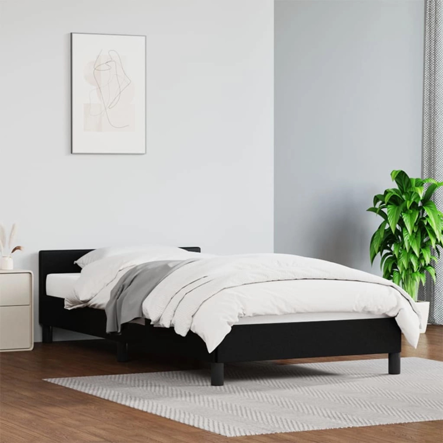 Schwarzes vidaXL Bettgestell (80x200 cm) mit Kopfteil aus Kunstleder im Schlafzimmer.