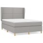 Hellgraues vidaXL Boxspringbett 140x190 cm mit Matratze und Kopfteil.