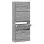 Grauer Sonoma Schuhschrank aus Holzwerkstoff mit 4 Kippfächern, eines offen. Ideal für Flur & Garderobe.