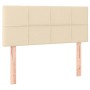 Cremefarbenes Boxspringbett Kopfteil 100x200 cm aus Stoff mit Holzfüßen.