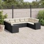 Schwarze 9-teilige Garten-Sofagarnitur aus Poly Rattan mit cremefarbenen Kissen.