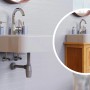 Grauer Kirchhoff Tassensiphon Eco Save aus recyceltem Kunststoff unter einem Waschbecken.