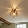 Goldene QAZQA Botanica Deckenleuchte mit Blattdesign, die dekorative Schatten an die Decke wirft. Vintage Lampe 24 cm.